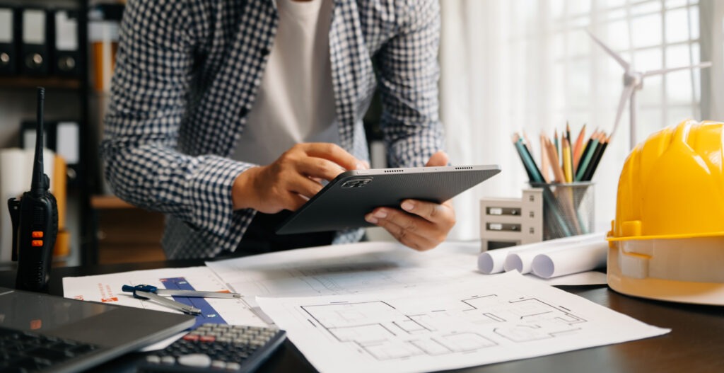 Why Industry-Led Training Matters in Construction Creative Architect Projecting Big Drawings With Architectural Project Construction Site 1024x527