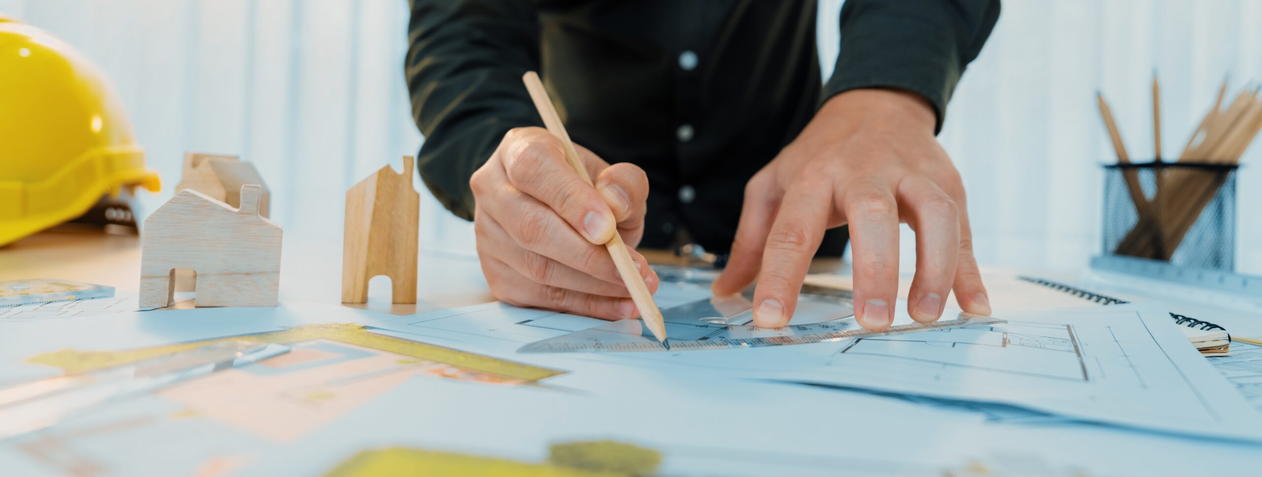 Professional Engineer Measuring Blueprint Professional Engineer Working Architectural Project Studio Table With Yellow Helmet Architectural Equipment Scatter Around Delineation Scaled