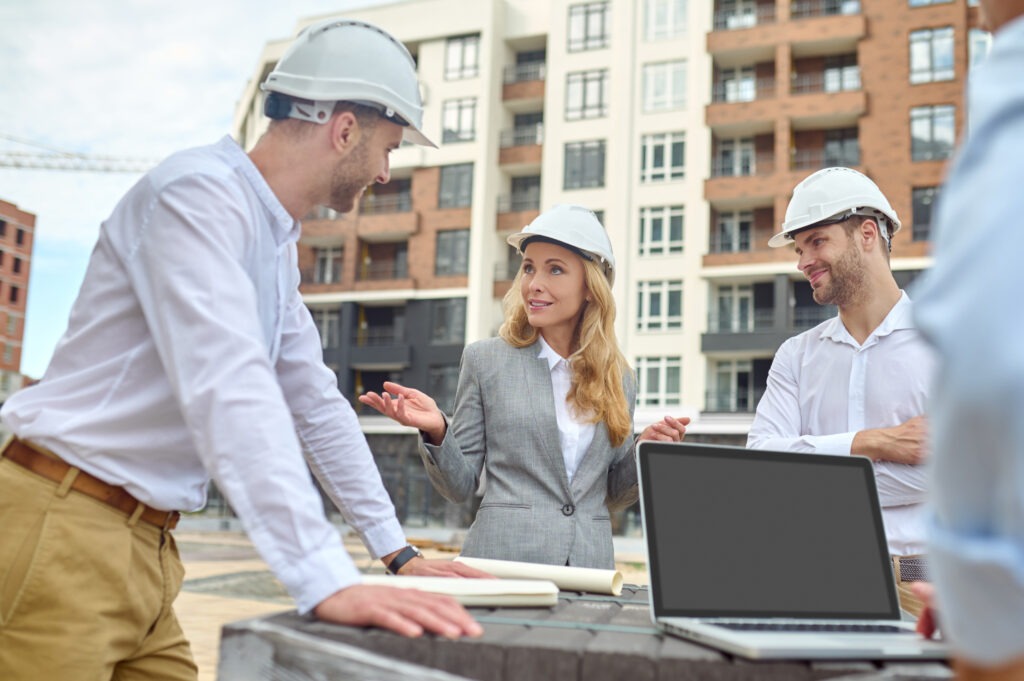 Build Hub Introduces Practical Learning for the Built Environment Sector Elegant Building Supervisor Talking Builders Outside 1024x681