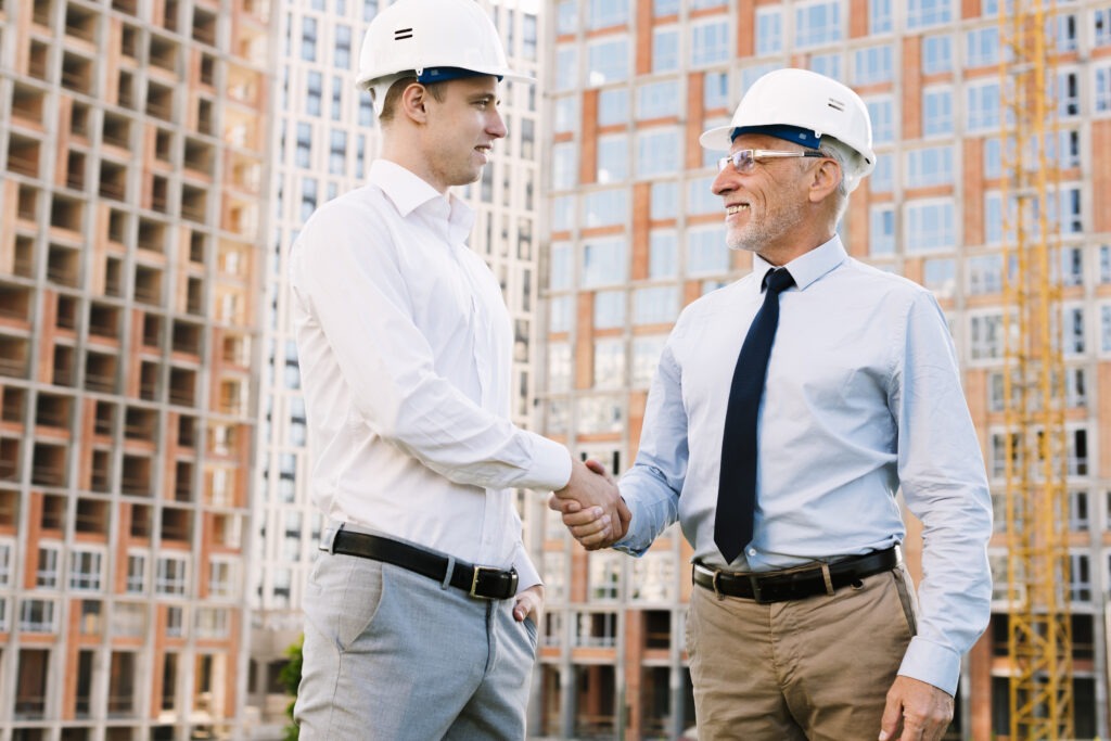 How Build Hub Supports Collaboration Across the Construction Ecosystem Low Angle Businessmen Making Agreement 1024x683